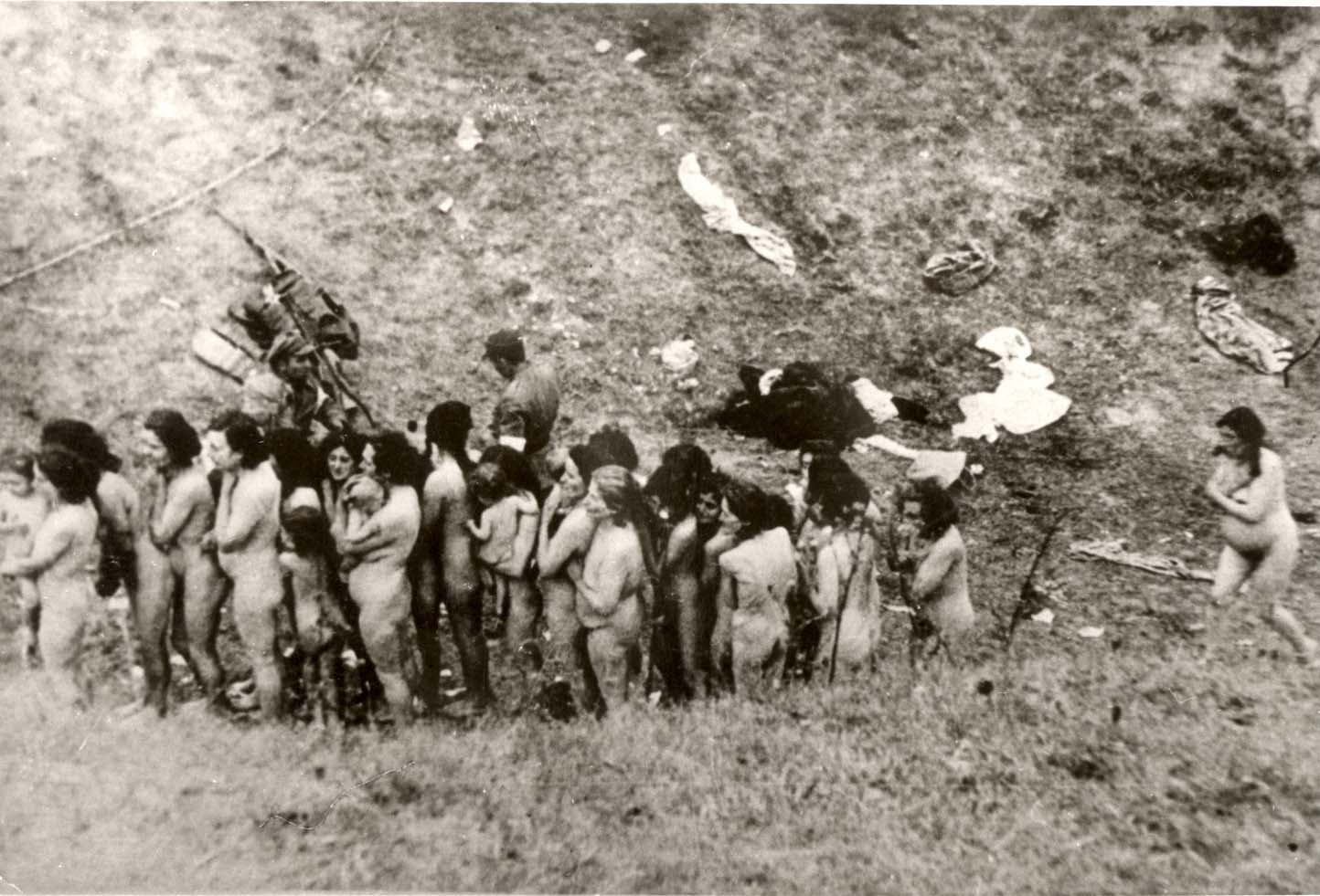 Women and children before being murdered. Photo taken by Gustav Hille, a German policeman